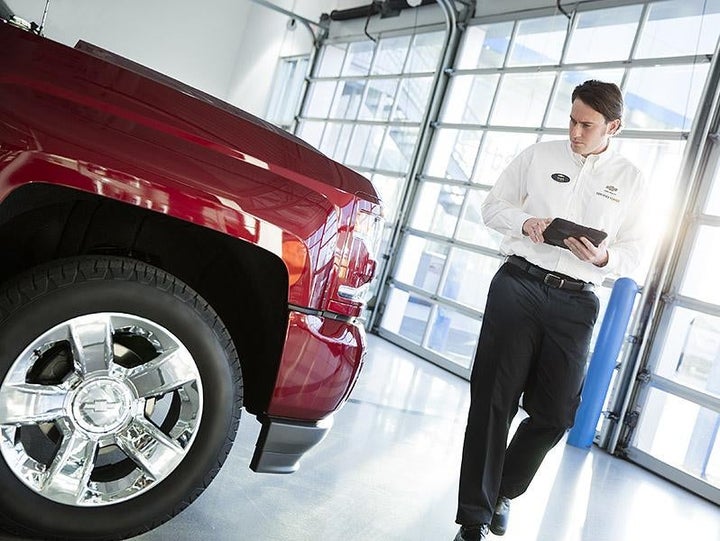 Mechanic Inspecting Truck